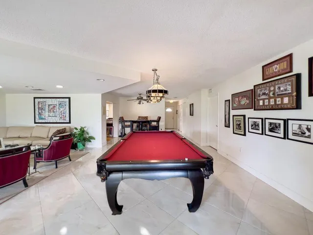 a room with furniture and flat screen tv