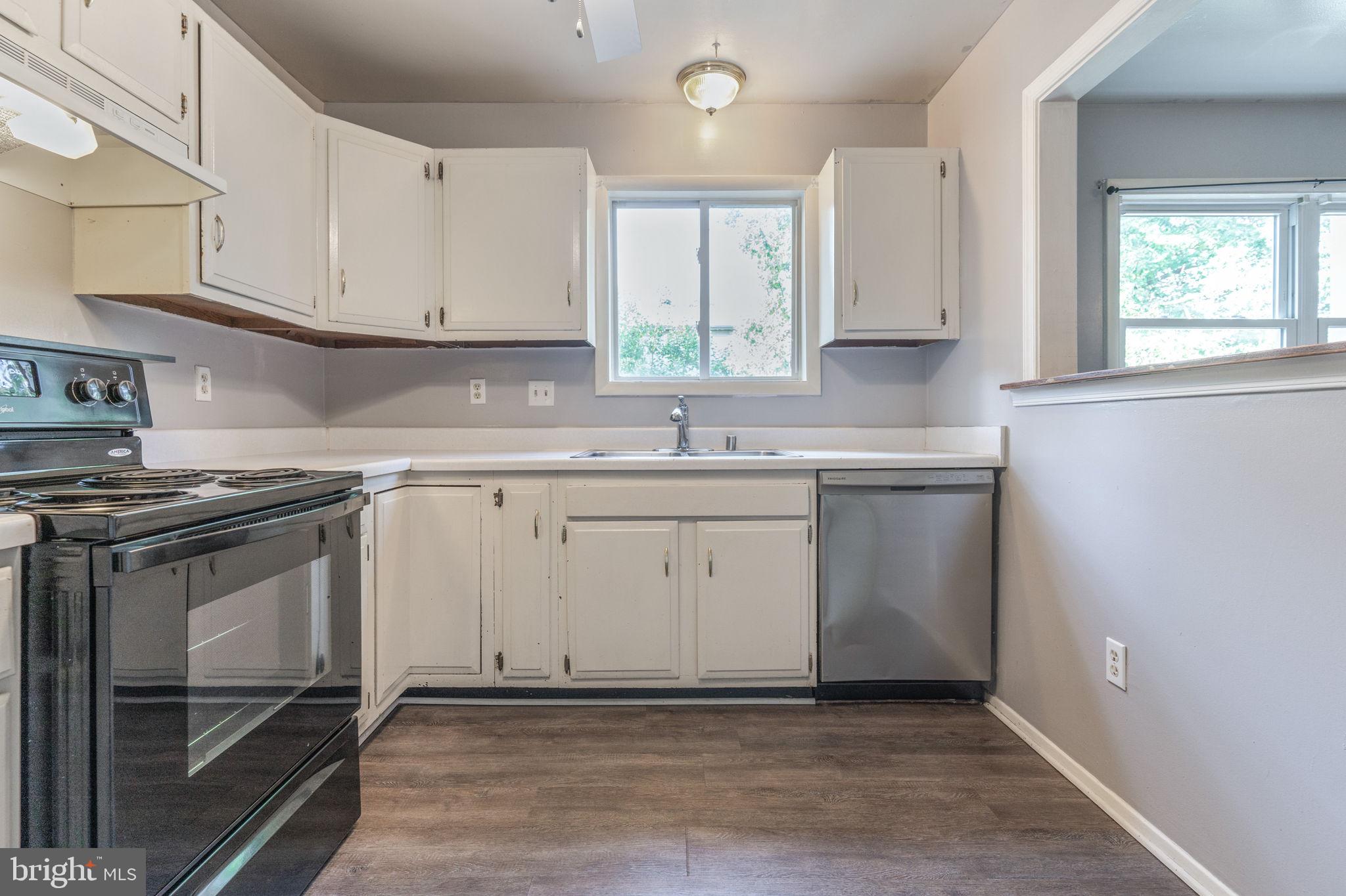 709 Olde Forge Drive Fredericksburg, VA 22405 - Photo 11 of 31 a kitchen with a sink stove and cabinets