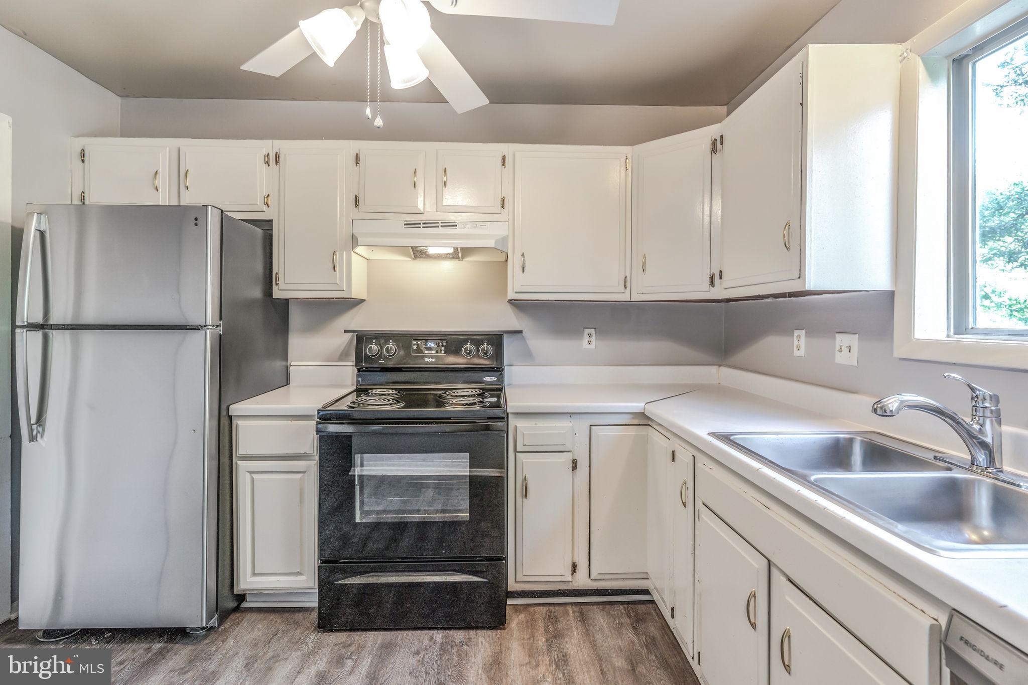 709 Olde Forge Drive Fredericksburg, VA 22405 - Photo 13 of 31 a kitchen with a sink appliances and cabinets