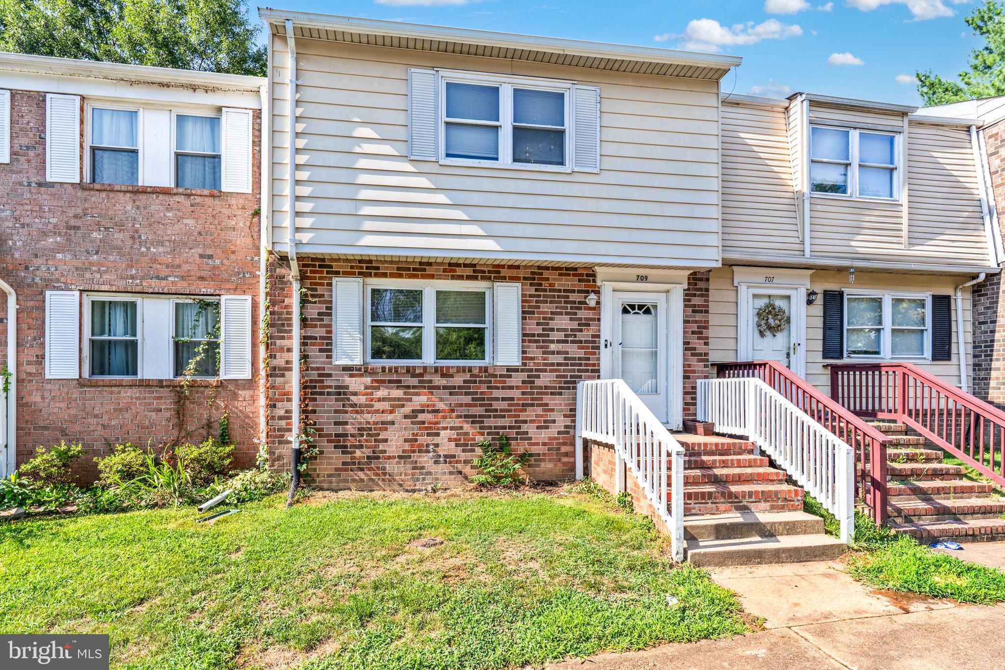 709 Olde Forge Drive Fredericksburg, VA 22405 - Photo 2 of 31 a front view of a house with garden