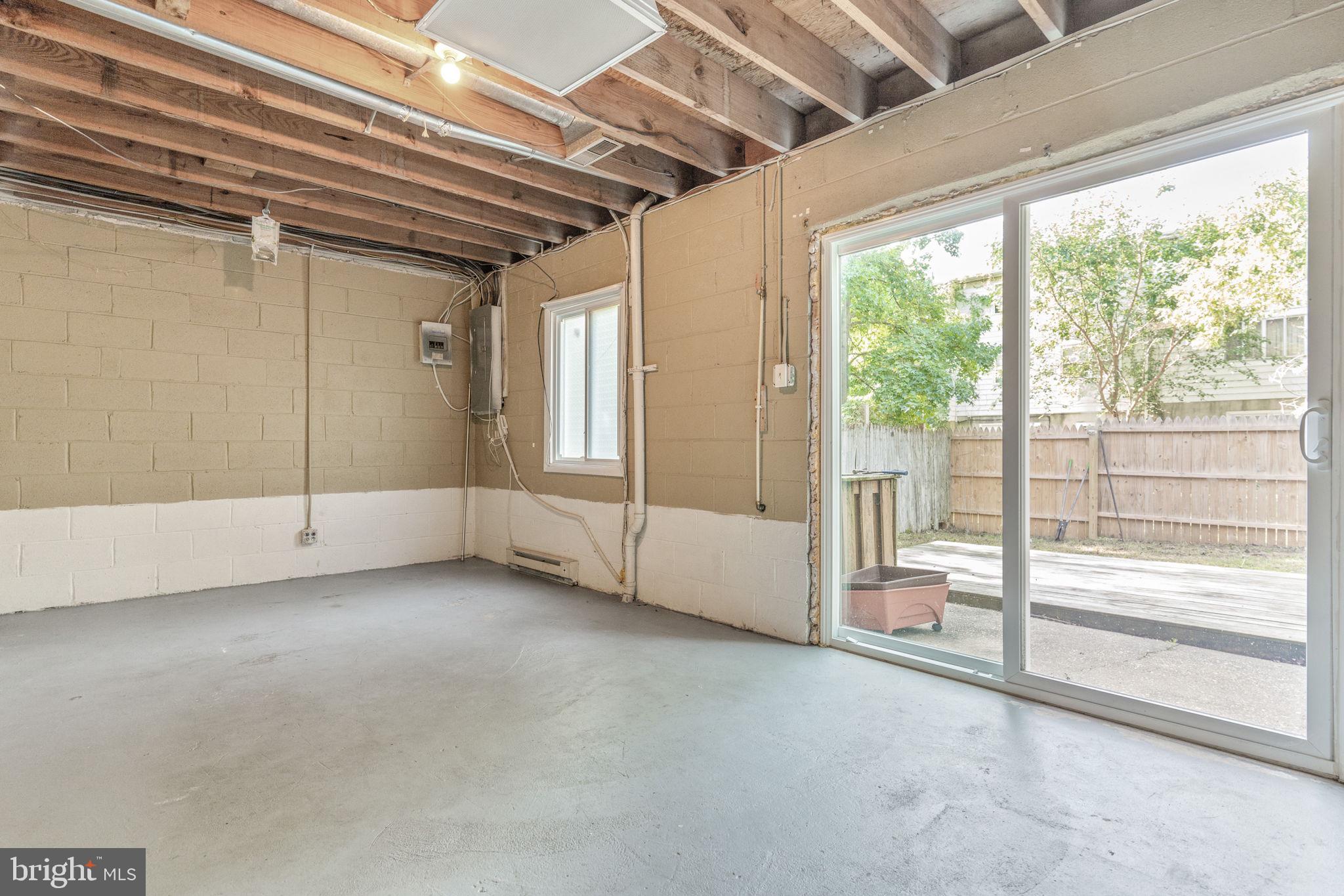 709 Olde Forge Drive Fredericksburg, VA 22405 - Photo 23 of 31 a view of an empty room with wooden floor and door