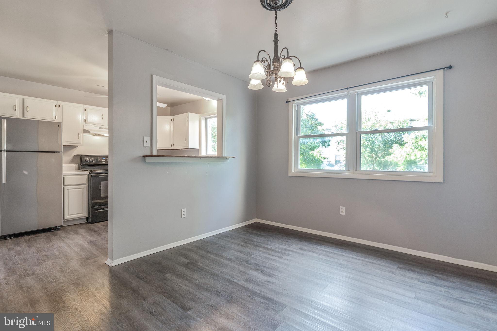 709 Olde Forge Drive Fredericksburg, VA 22405 - Photo 8 of 31 a view of an empty room with wooden floor and a window
