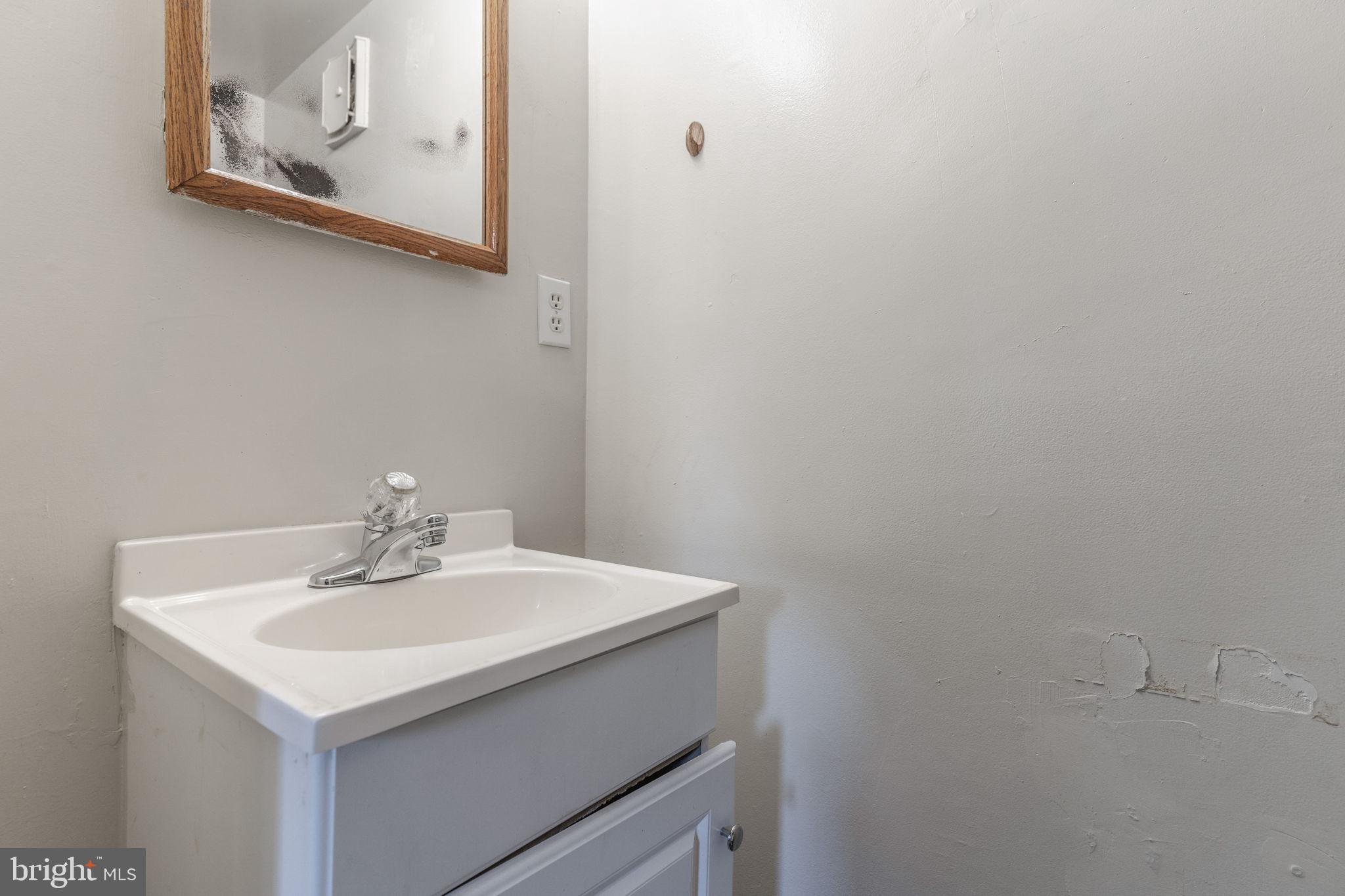 709 Olde Forge Drive Fredericksburg, VA 22405 - Photo 10 of 31 a bathroom with a sink and a mirror