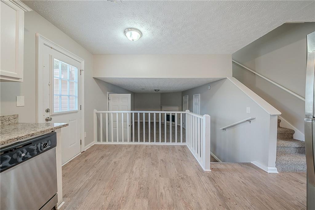2183 Ramblewood Circle Decatur, GA 30035 - Photo 5 of 37 a view of a hallway with wooden floor and staircase