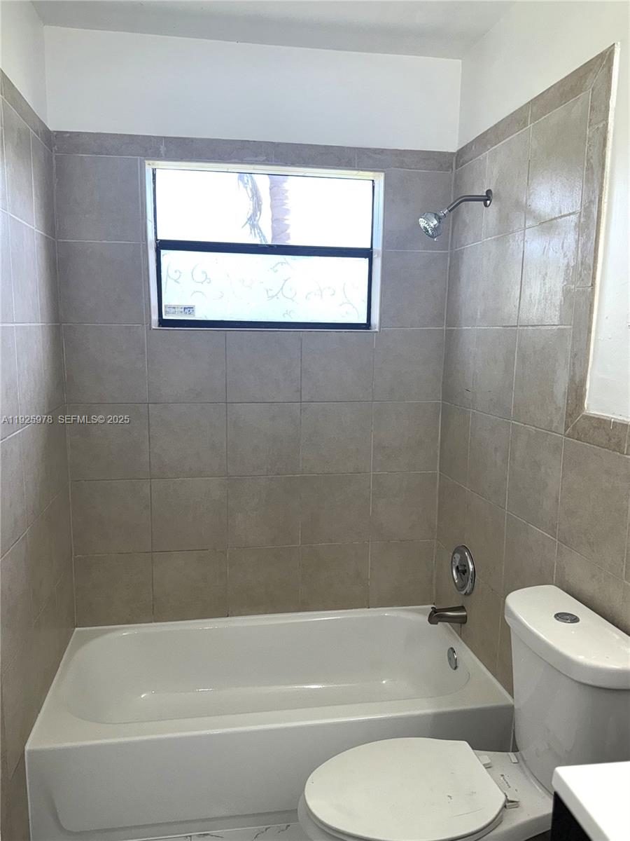10840 Southwest 222nd Drive Miami, FL 33170 - Photo 14 of 21 a bathroom with a toilet bathtub and shower