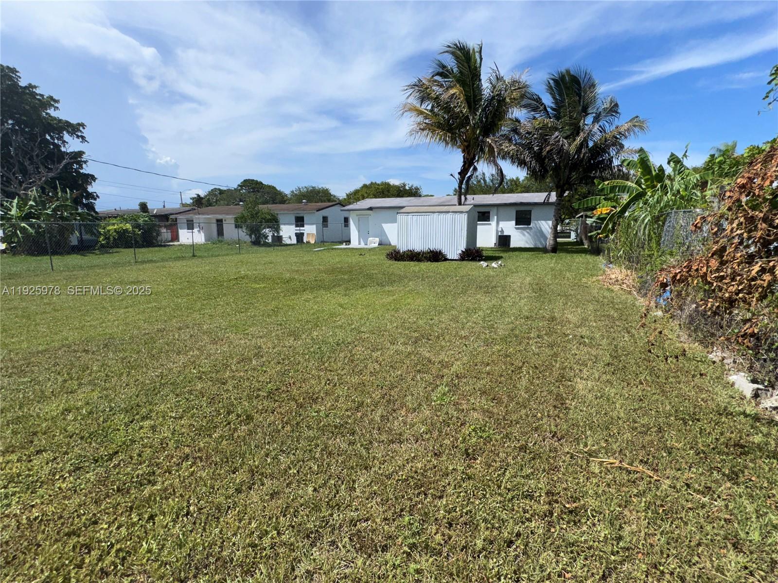 10840 Southwest 222nd Drive Miami, FL 33170 - Photo 19 of 21 a view of a house with a garden
