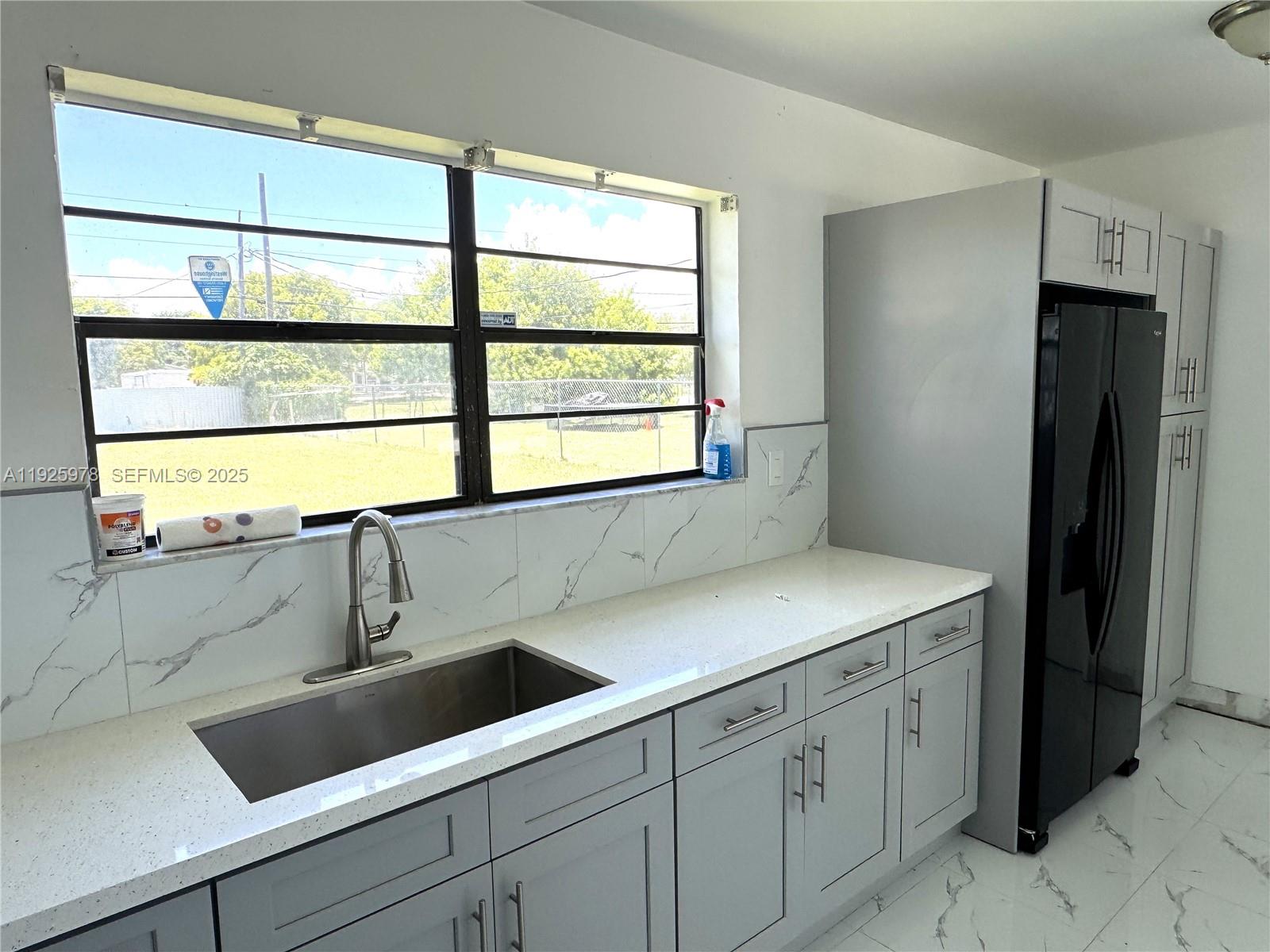 10840 Southwest 222nd Drive Miami, FL 33170 - Photo 6 of 21 a sink with a window