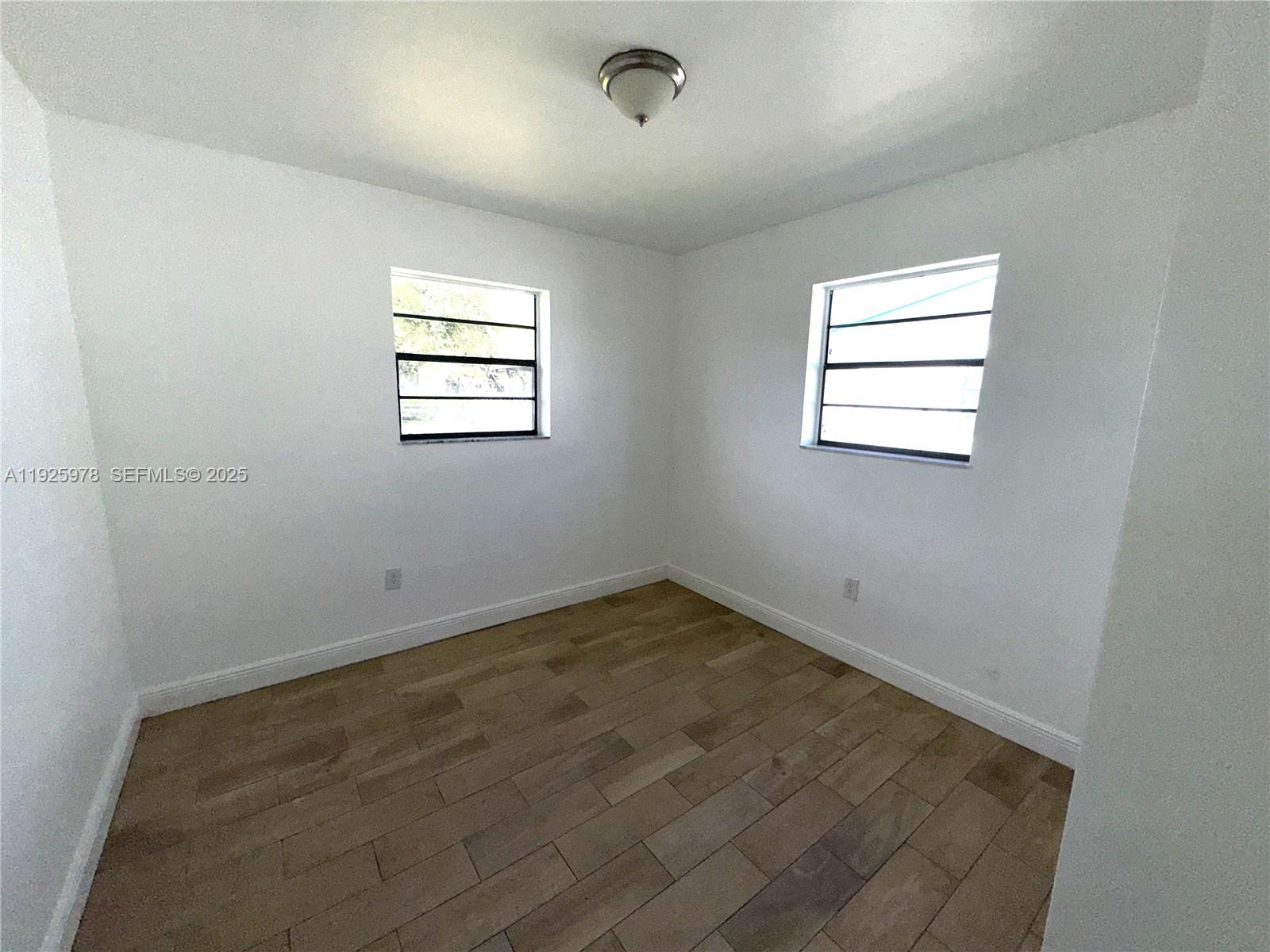 10840 Southwest 222nd Drive Miami, FL 33170 - Photo 10 of 21 an empty room with a window