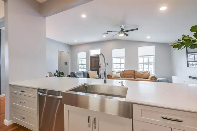 a view of a kitchen counter space cabinets and stainless steel appliances
