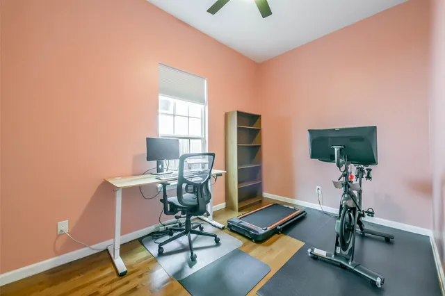 a work room with furniture and wooden floor