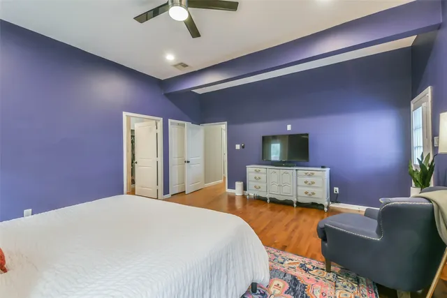 a bedroom with a bed couch and window