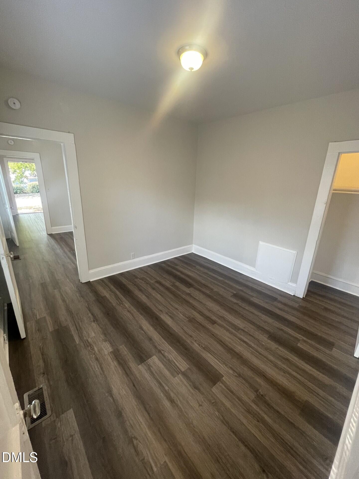 307 Kennedy Street Raleigh, NC 27610 - Photo 8 of 12 wooden floor in an empty room