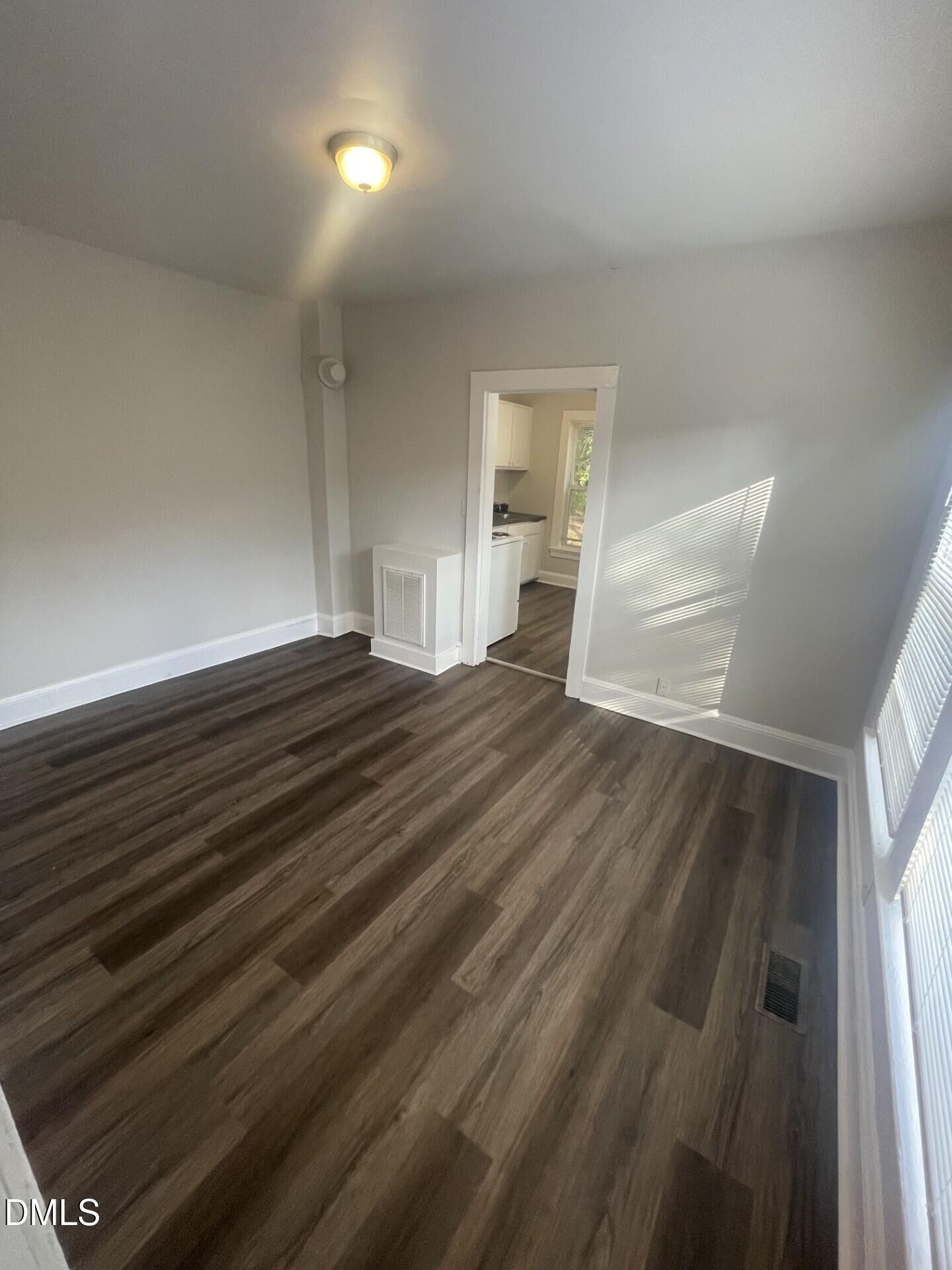 307 Kennedy Street Raleigh, NC 27610 - Photo 9 of 12 a view of empty room with wooden floor