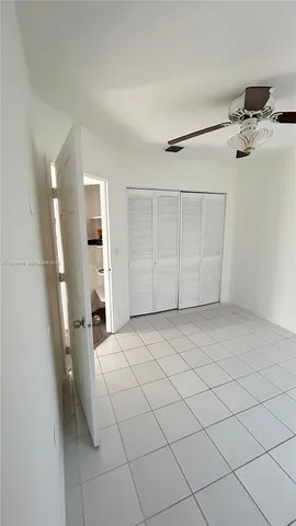 a view of a livingroom with a dishwasher and a refrigerator