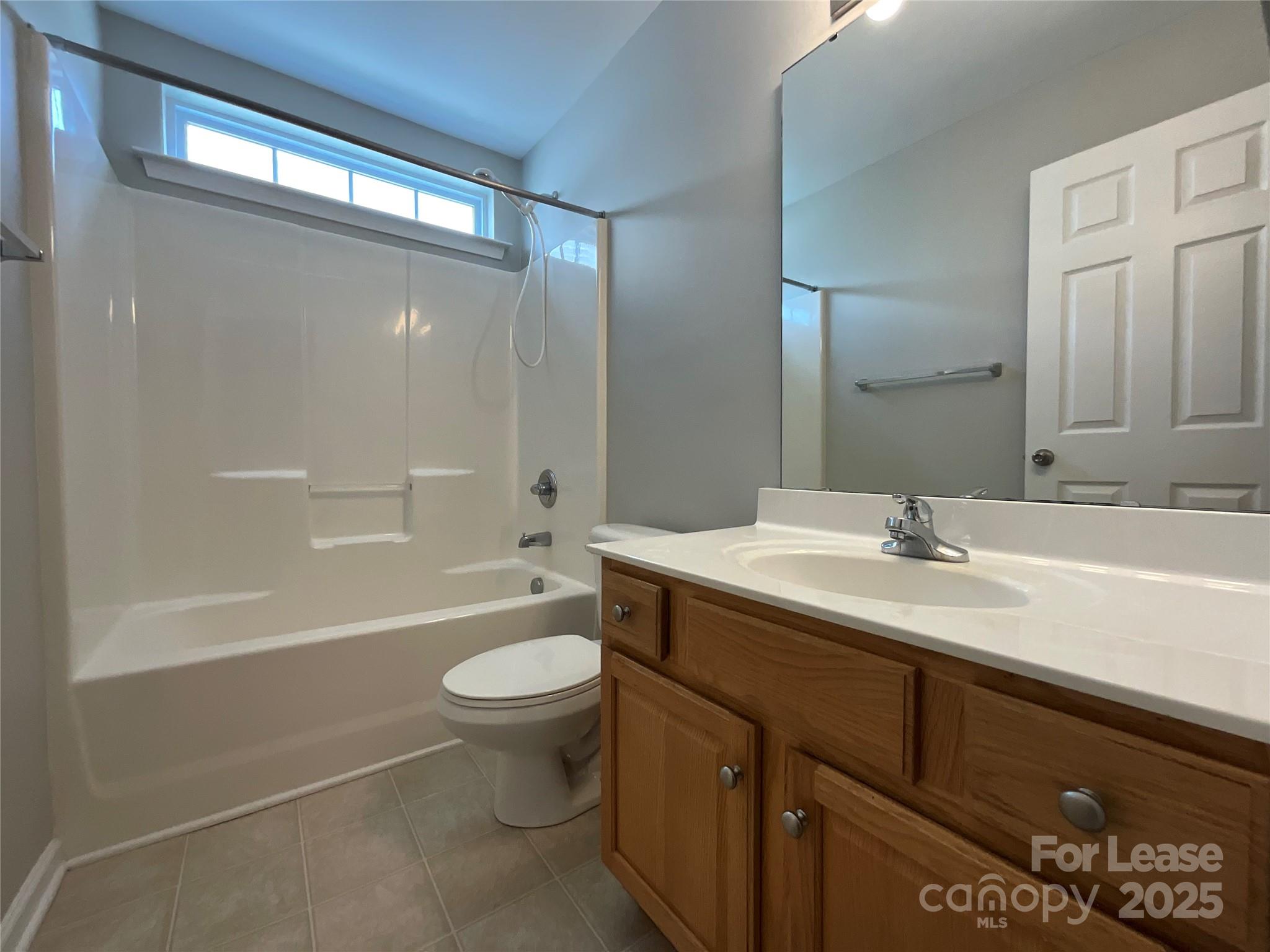 10846 Traders Court Davidson, NC 28036 - Photo 13 of 24 a bathroom with a sink a toilet and shower