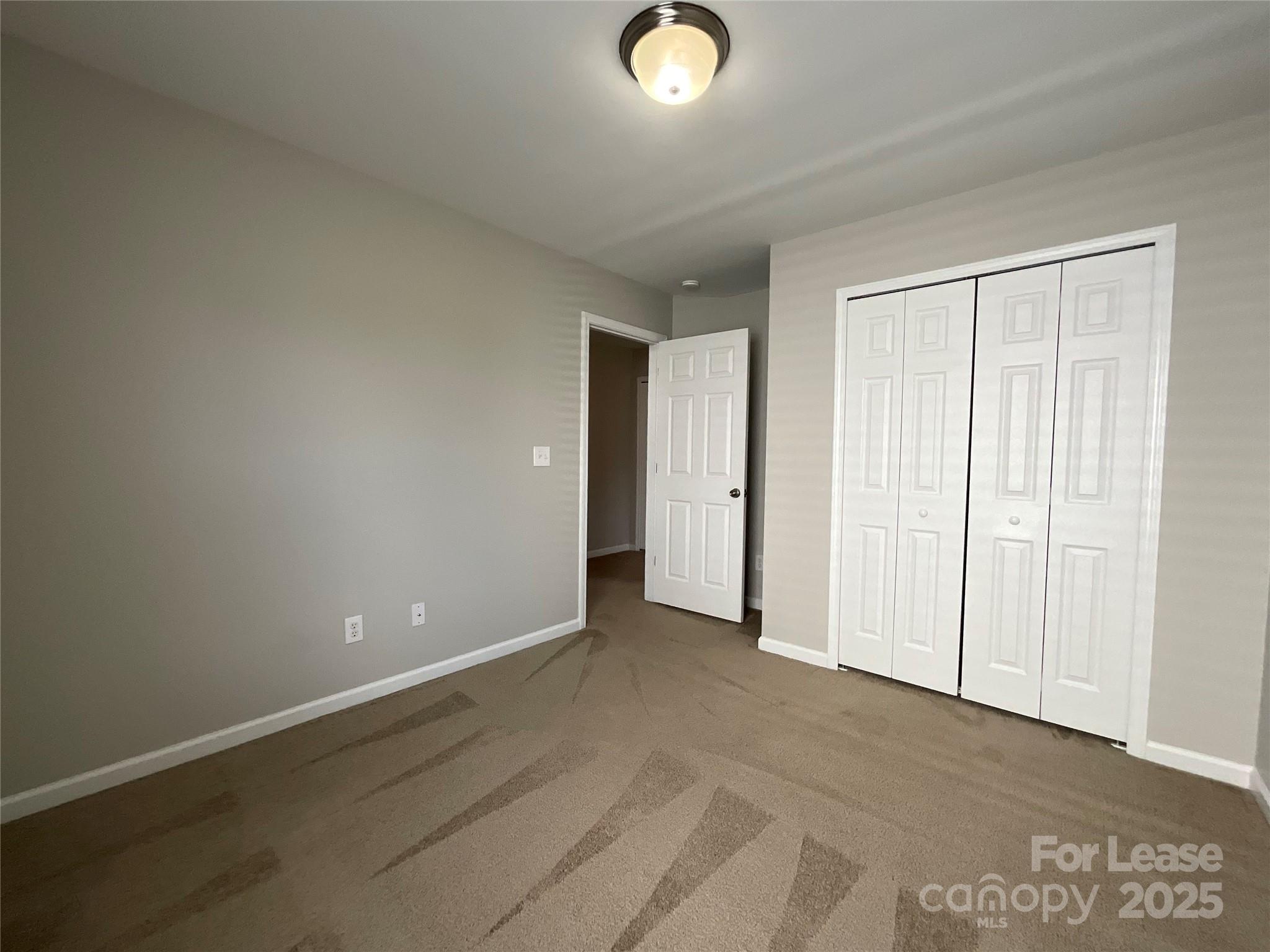 10846 Traders Court Davidson, NC 28036 - Photo 15 of 24 an empty room with closet area