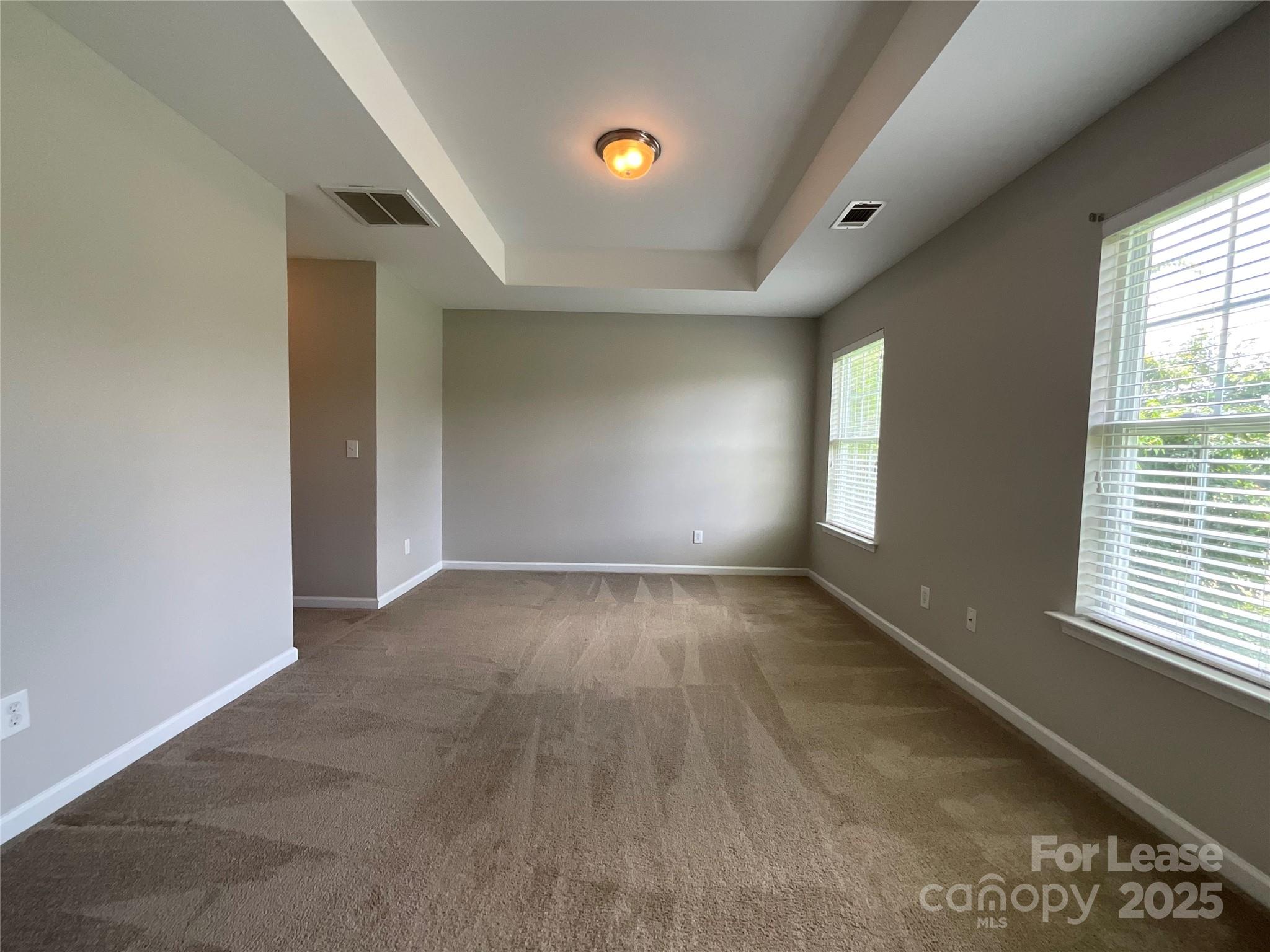 10846 Traders Court Davidson, NC 28036 - Photo 18 of 24 an empty room with windows