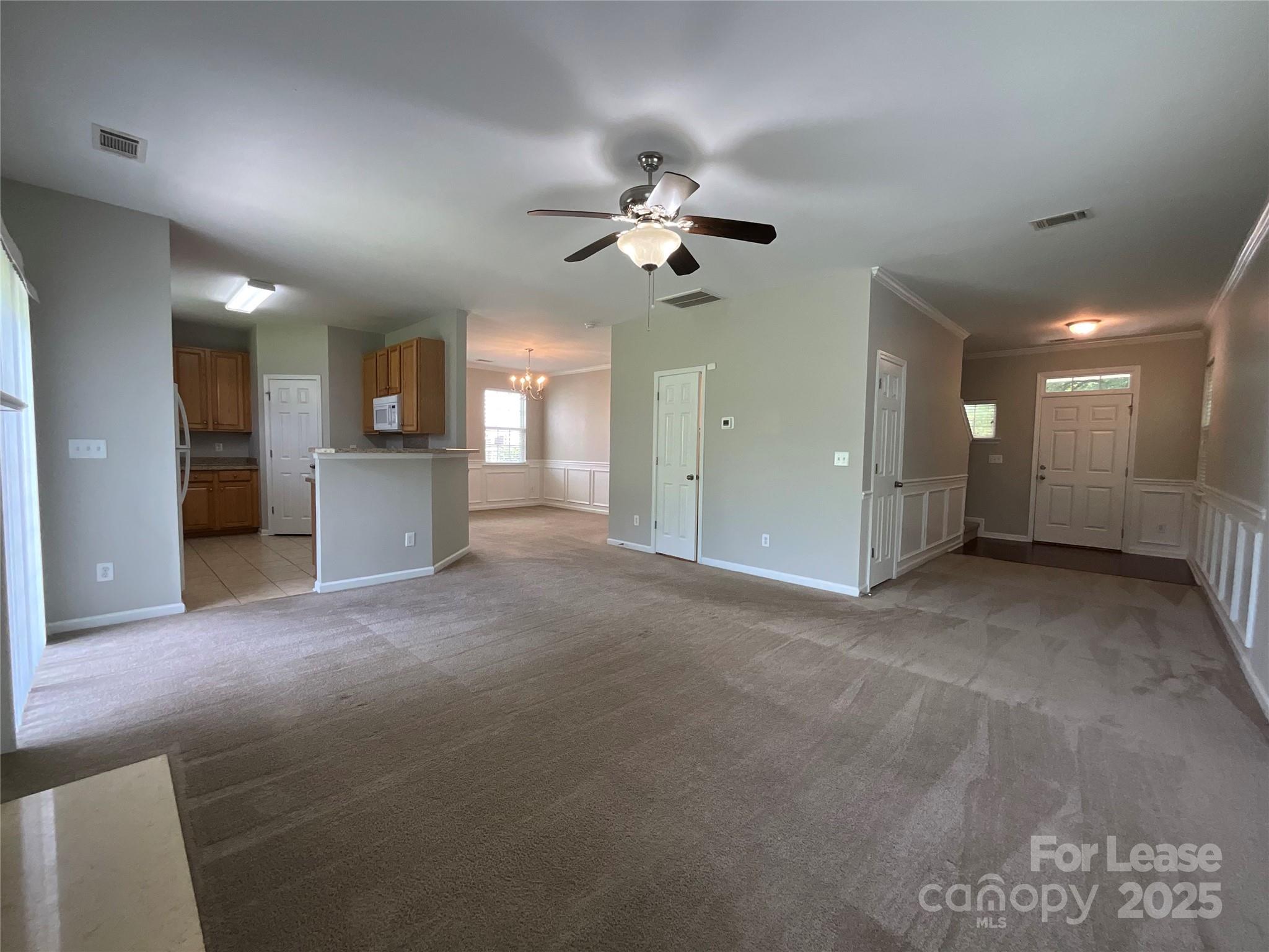 10846 Traders Court Davidson, NC 28036 - Photo 4 of 24 a view of a kitchen with a sink and a refrigerator