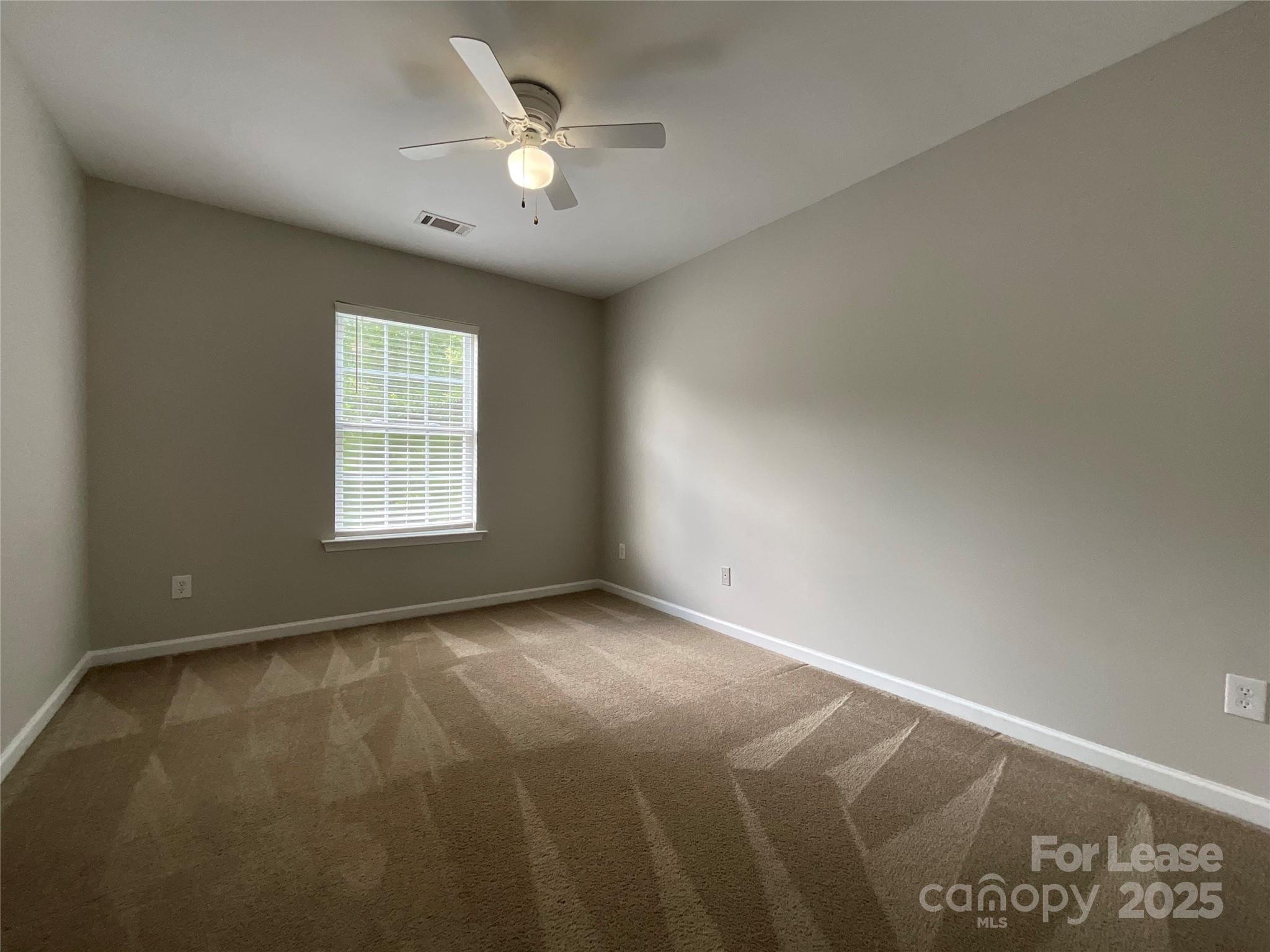 10846 Traders Court Davidson, NC 28036 - Photo 9 of 24 an empty room with windows