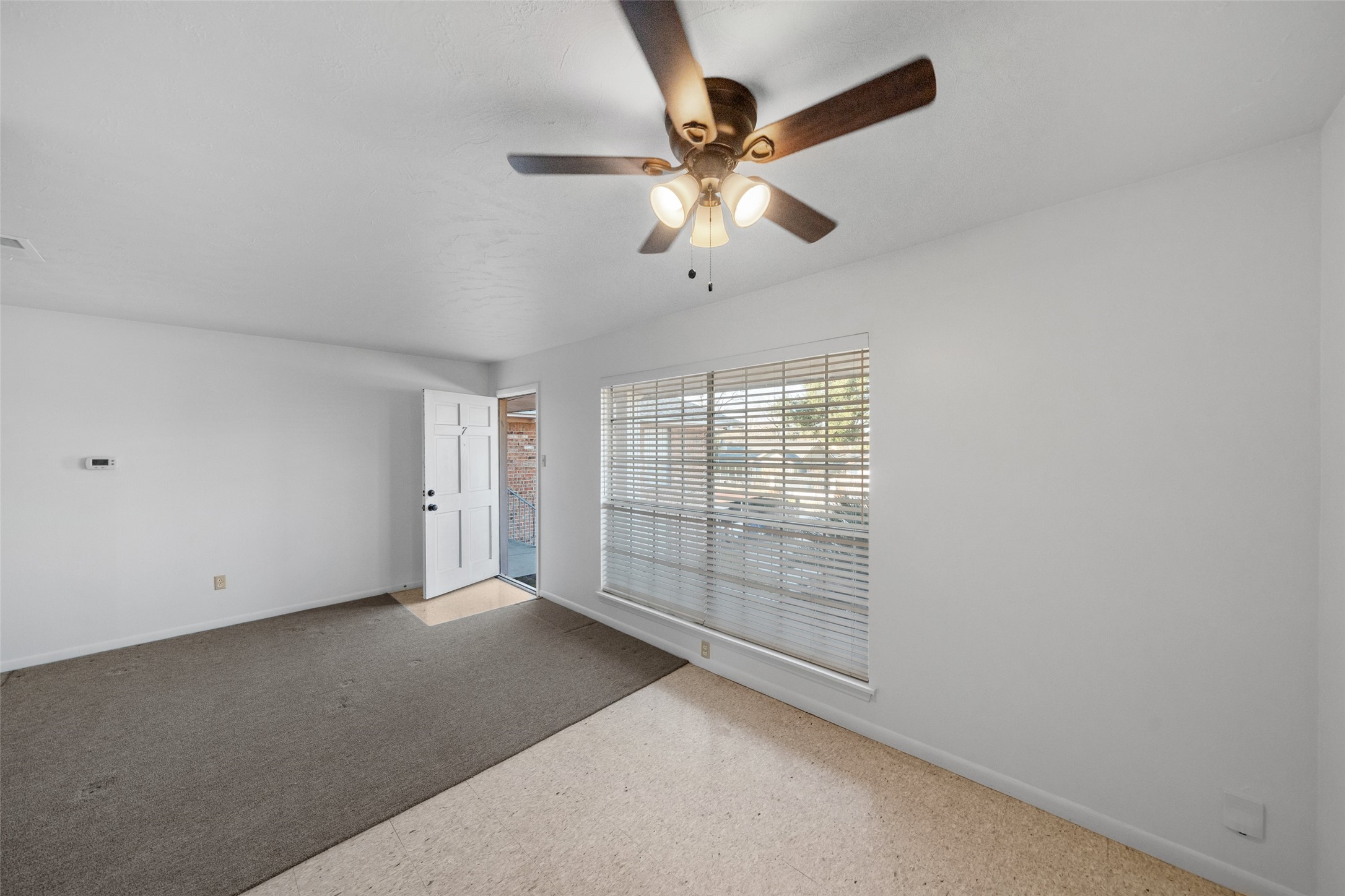 926 East 14th Street, Unit 7 Houston, TX 77009 - Photo 2 of 17 a view of an empty room with a window
