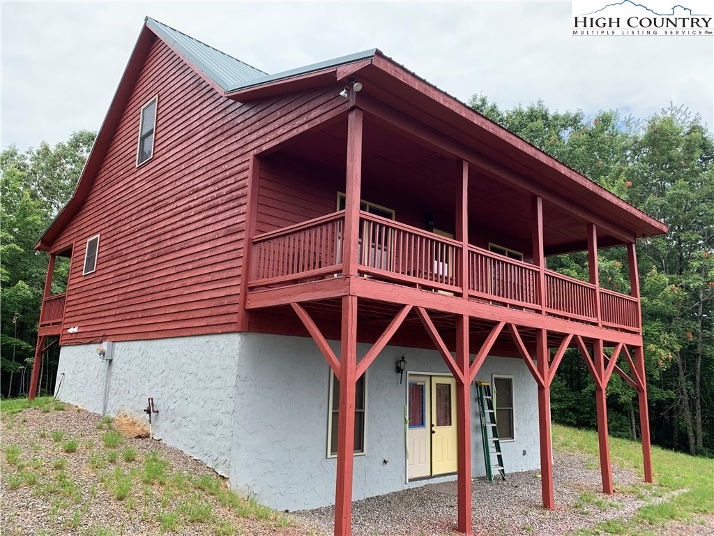 305 Wolf Pen Road Purlear, NC 28665 - Photo 1 of 40 a front view of a house with parking
