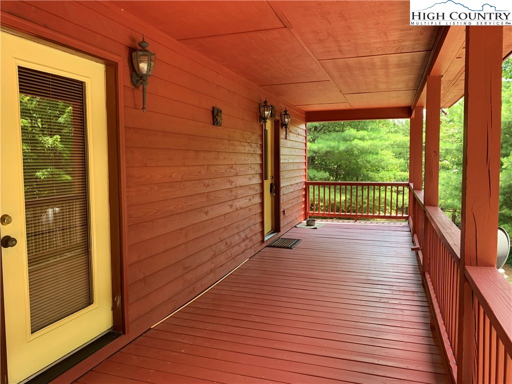 305 Wolf Pen Road Purlear, NC 28665 - Photo 12 of 40 a view of a balcony with wooden floor