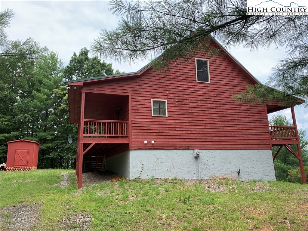 305 Wolf Pen Road Purlear, NC 28665 - Photo 2 of 40 a backyard of a house with lots of green space