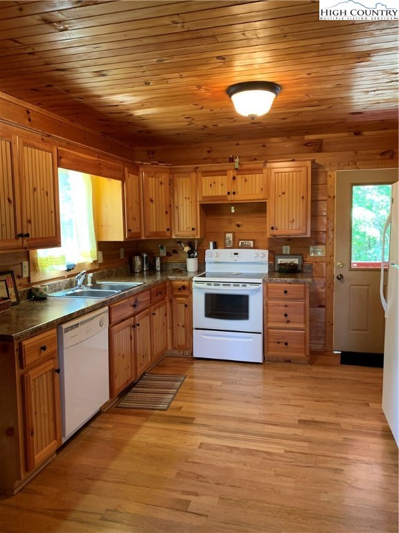 305 Wolf Pen Road Purlear, NC 28665 - Photo 22 of 40 a kitchen with stainless steel appliances granite countertop a stove a sink and a microwave