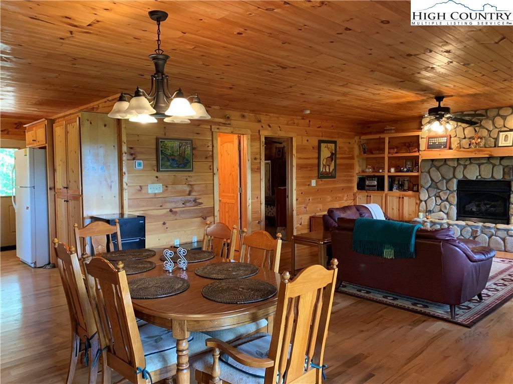 305 Wolf Pen Road Purlear, NC 28665 - Photo 25 of 40 a view of a dining room with furniture