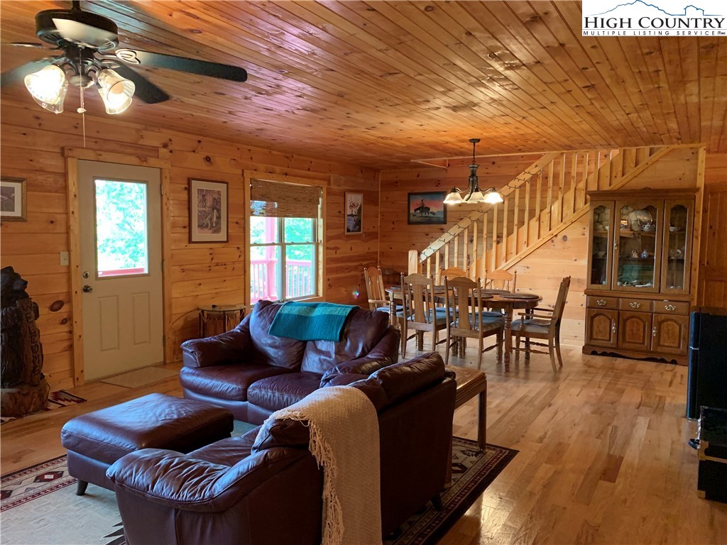 305 Wolf Pen Road Purlear, NC 28665 - Photo 26 of 40 a living room with furniture and wooden floor