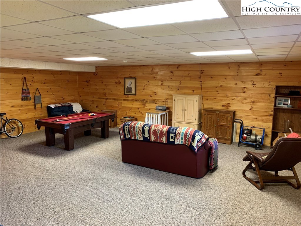 305 Wolf Pen Road Purlear, NC 28665 - Photo 37 of 40 a living room with furniture and a flat screen tv