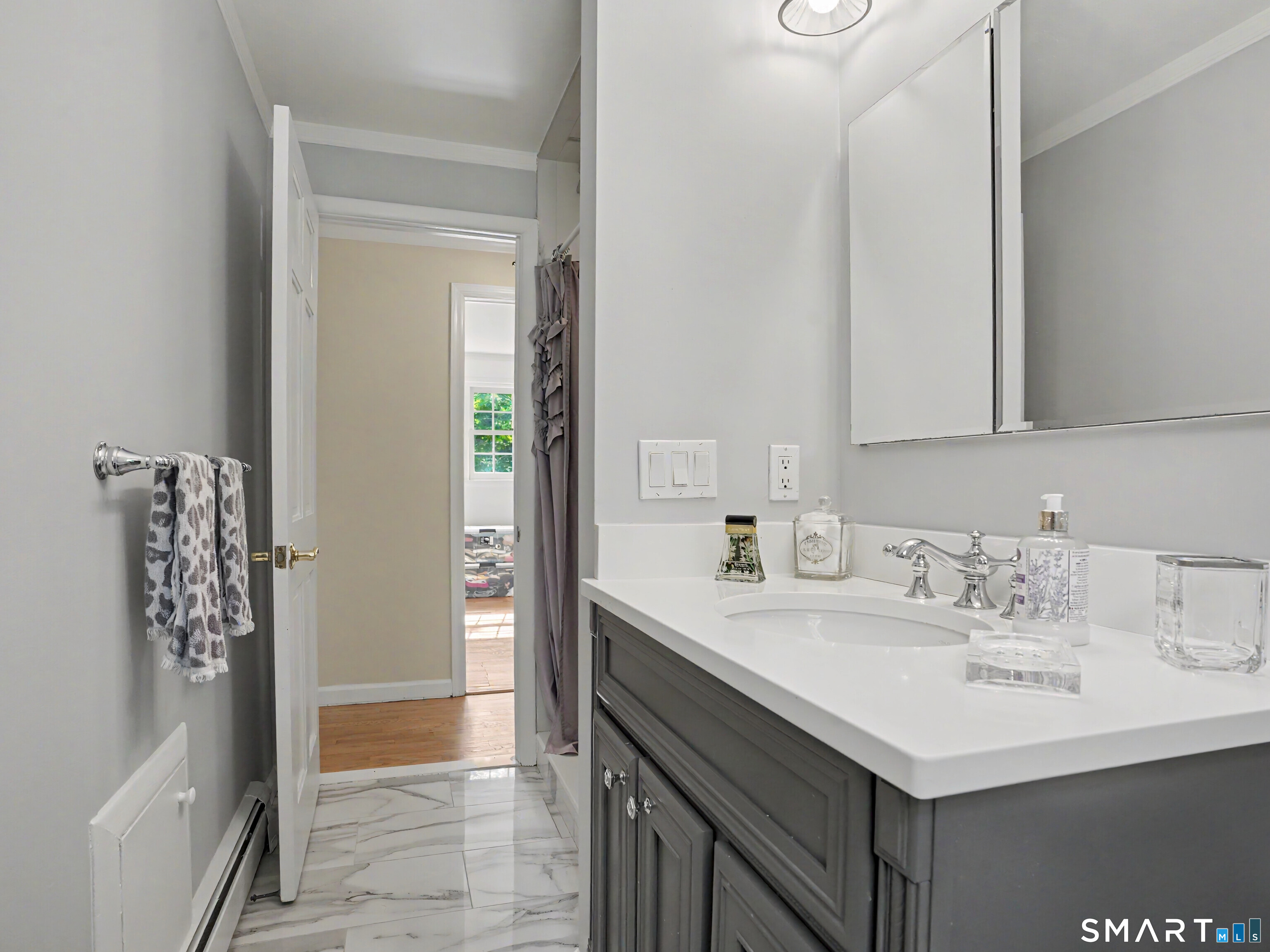 15 Flat Rock Drive Ridgefield, CT 06877 - Photo 19 of 39 a bathroom with a sink a vanity and a mirror