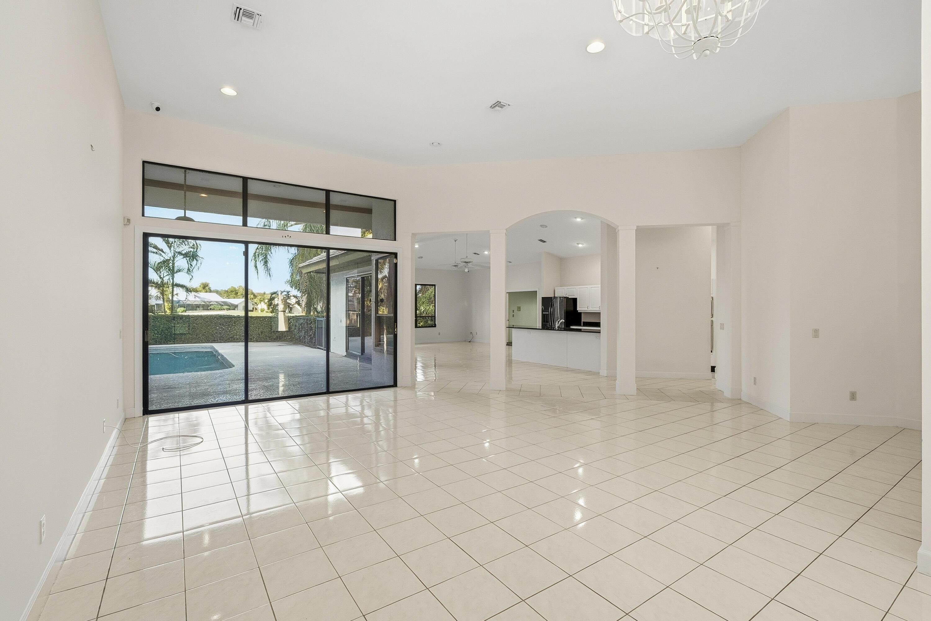 6469 Southeast Baltusrol Terrace Stuart, FL 34997 - Photo 13 of 65 a view of kitchen with furniture and large window