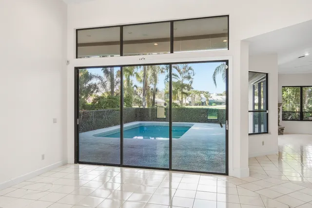 a very nice looking room with a large window and a chandelier