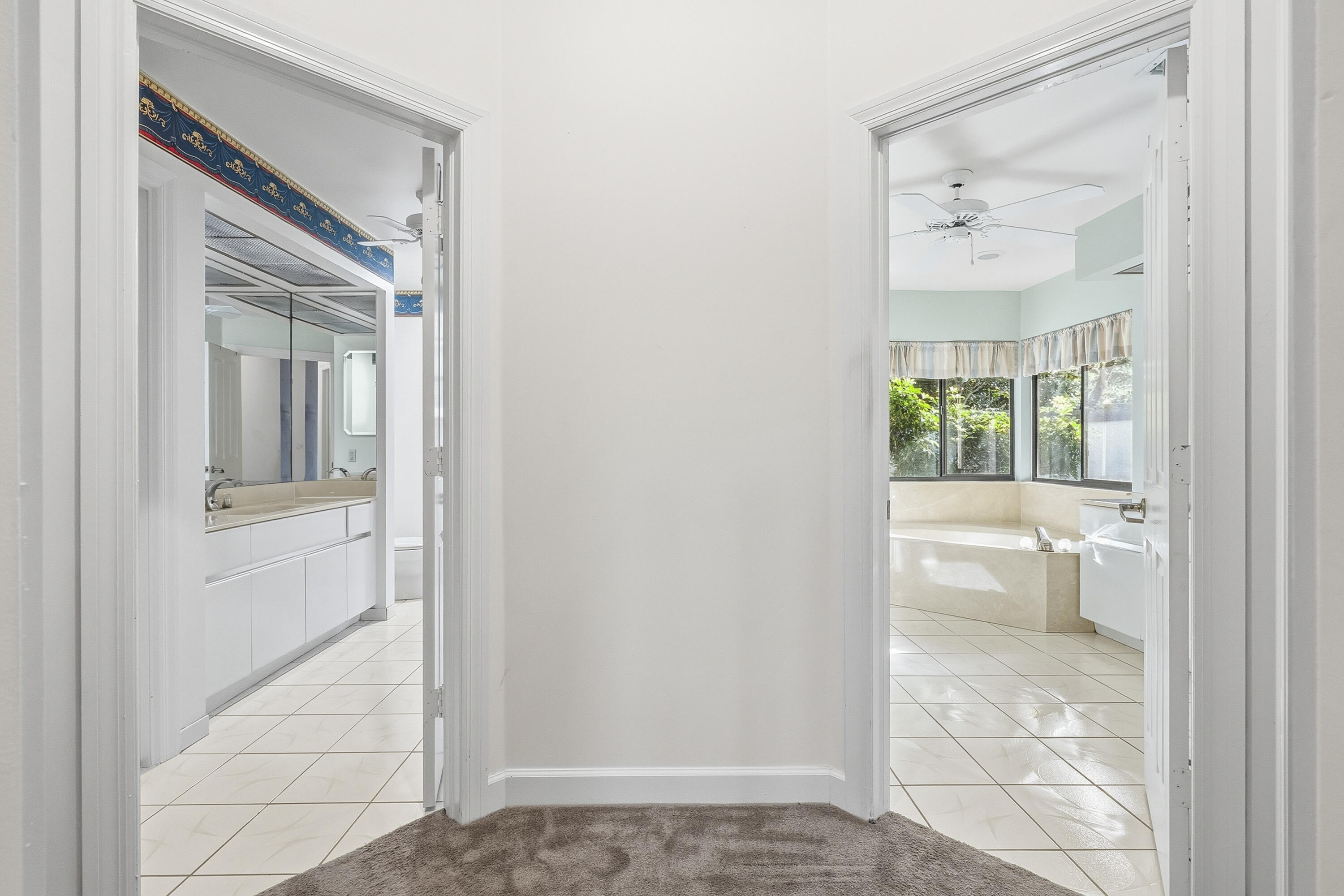 6469 Southeast Baltusrol Terrace Stuart, FL 34997 - Photo 26 of 65 a view of a bathroom with a glass door