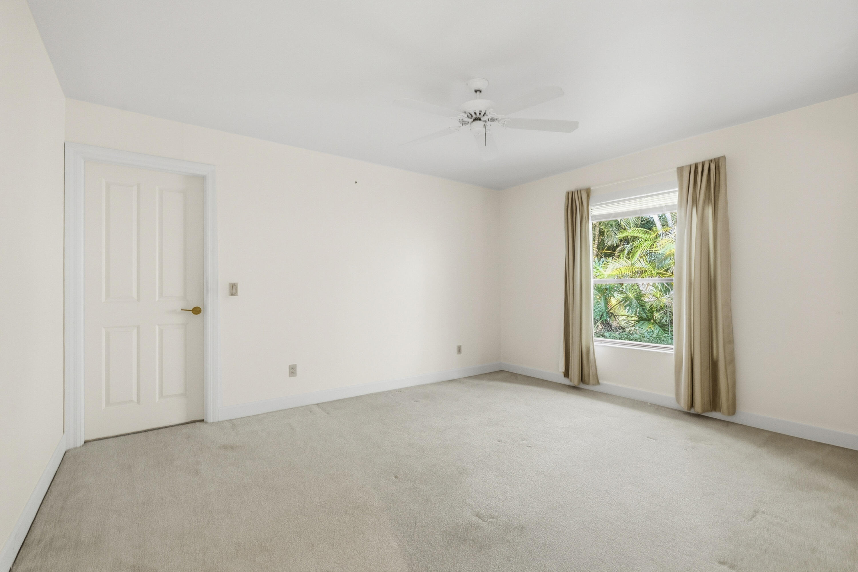 6469 Southeast Baltusrol Terrace Stuart, FL 34997 - Photo 34 of 65 an empty room with windows