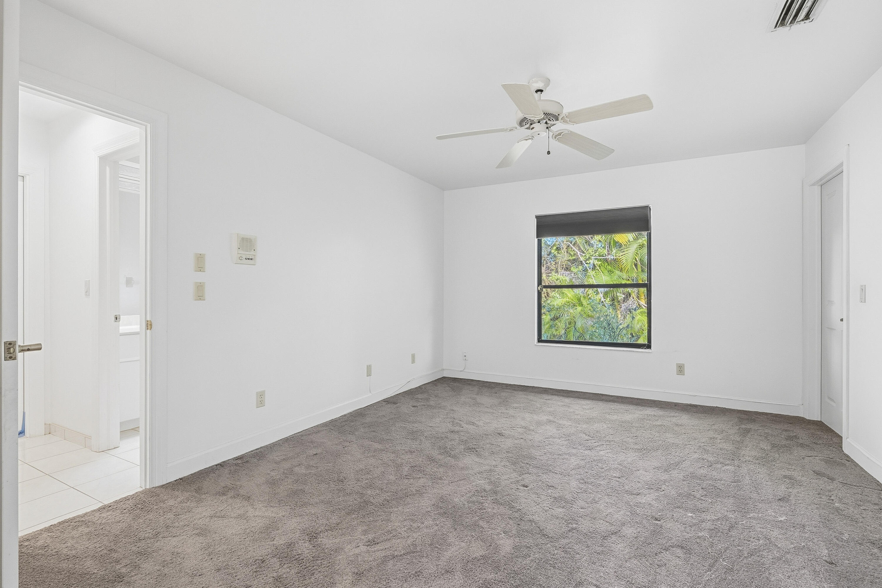 6469 Southeast Baltusrol Terrace Stuart, FL 34997 - Photo 36 of 65 an empty room with windows and closet