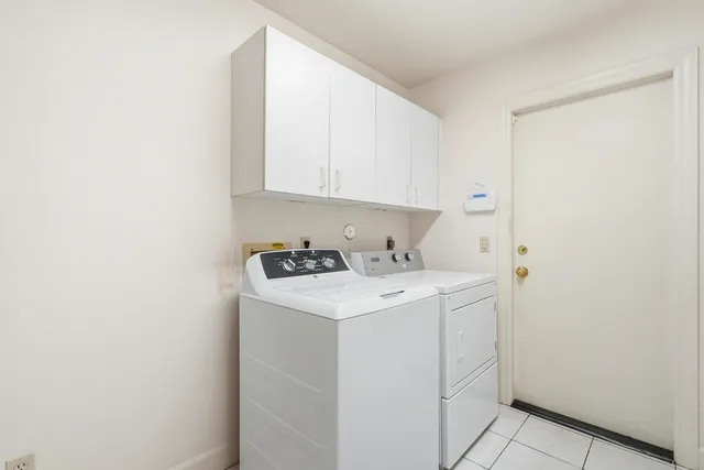 an aerial view of a house with a swimming pool outdoor seating and yard