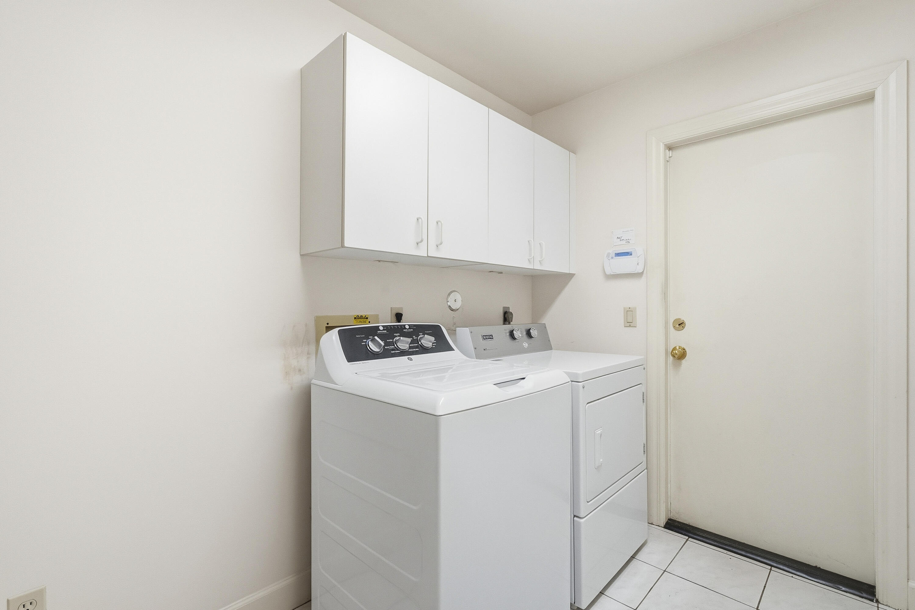 6469 Southeast Baltusrol Terrace Stuart, FL 34997 - Photo 39 of 65 a view of utility room with washer and dryer