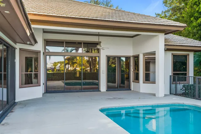 a view of a house with large windows