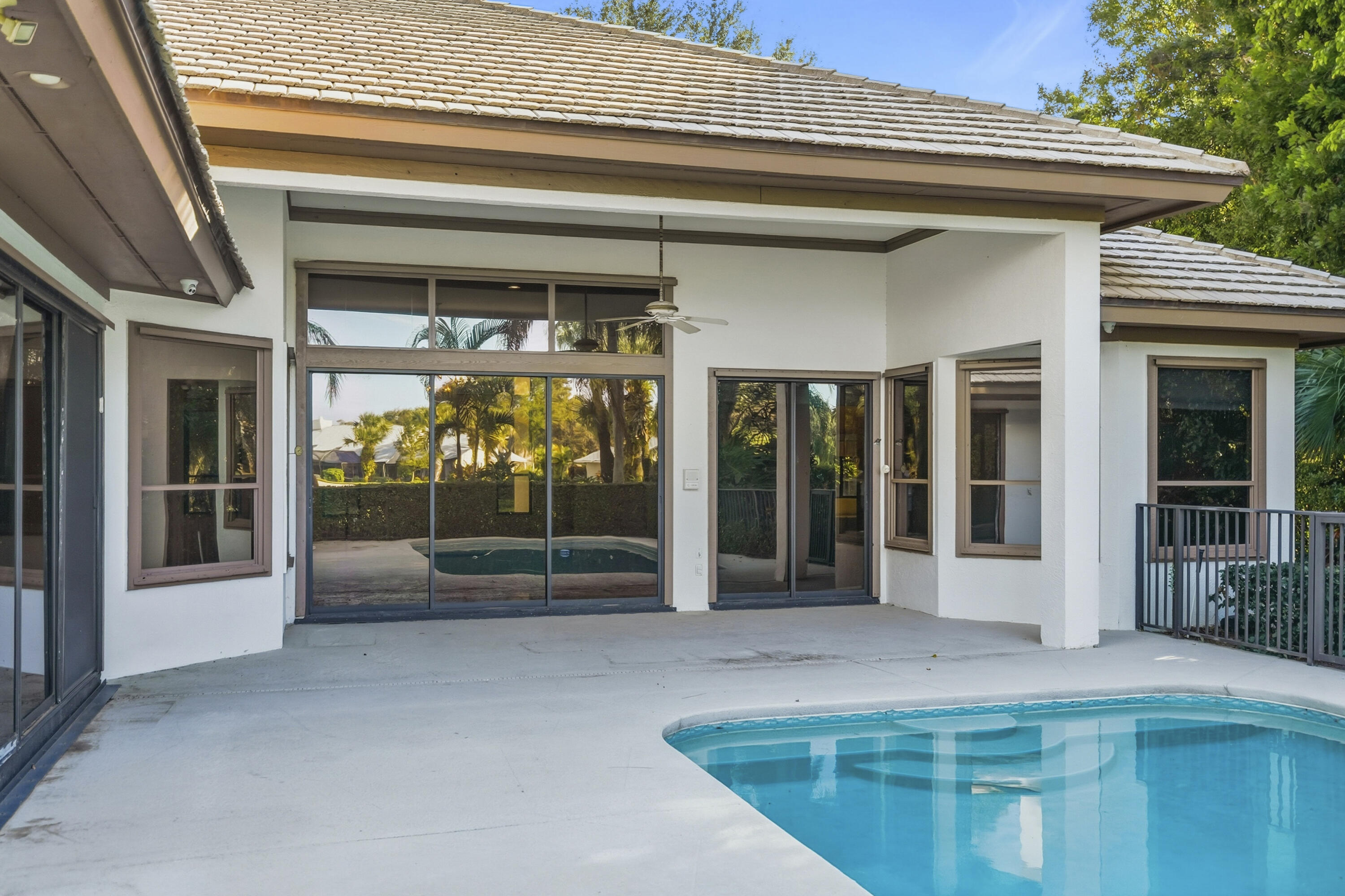6469 Southeast Baltusrol Terrace Stuart, FL 34997 - Photo 5 of 65 a view of a house with large windows