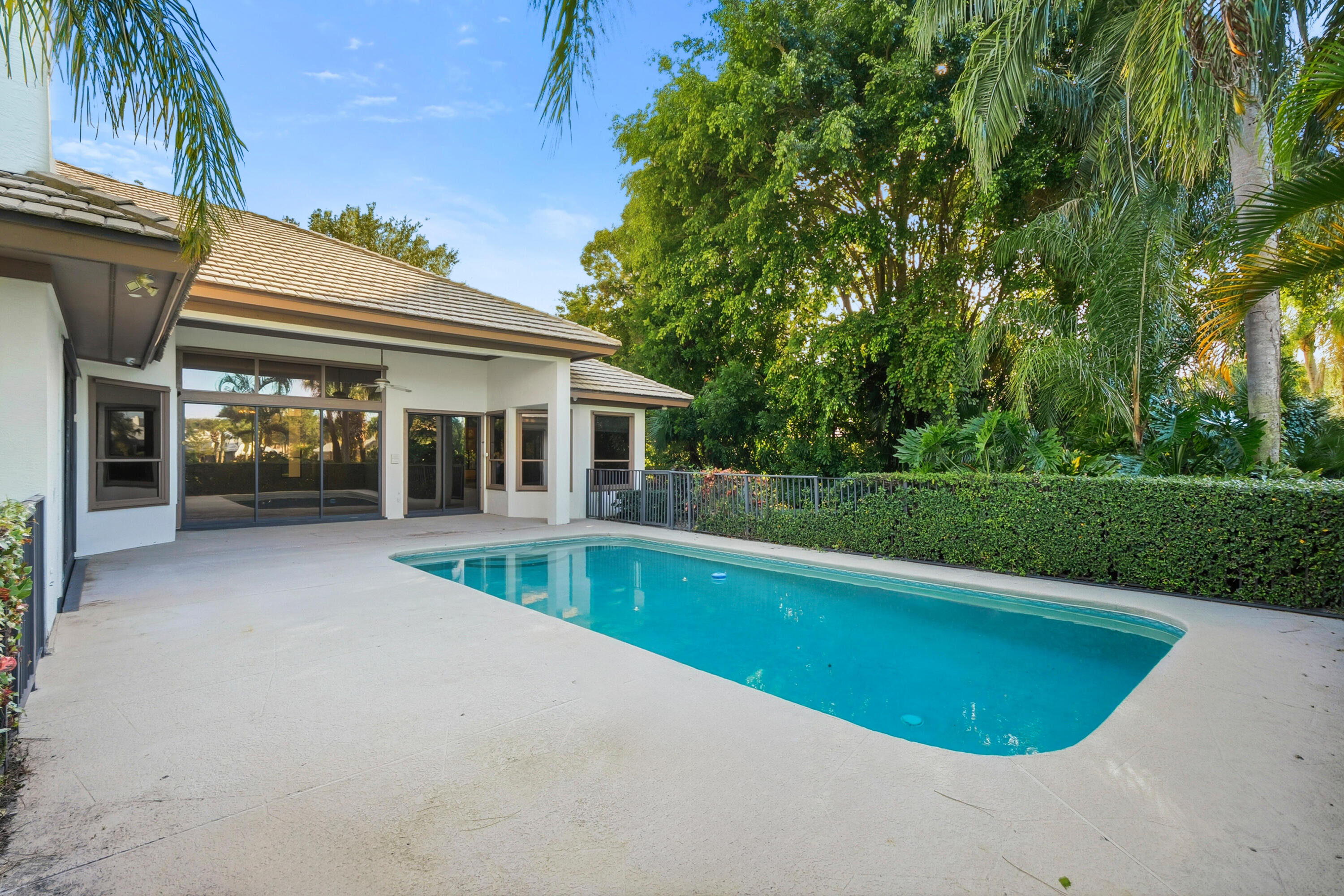 6469 Southeast Baltusrol Terrace Stuart, FL 34997 - Photo 6 of 65 a view of house with swimming pool and a yard