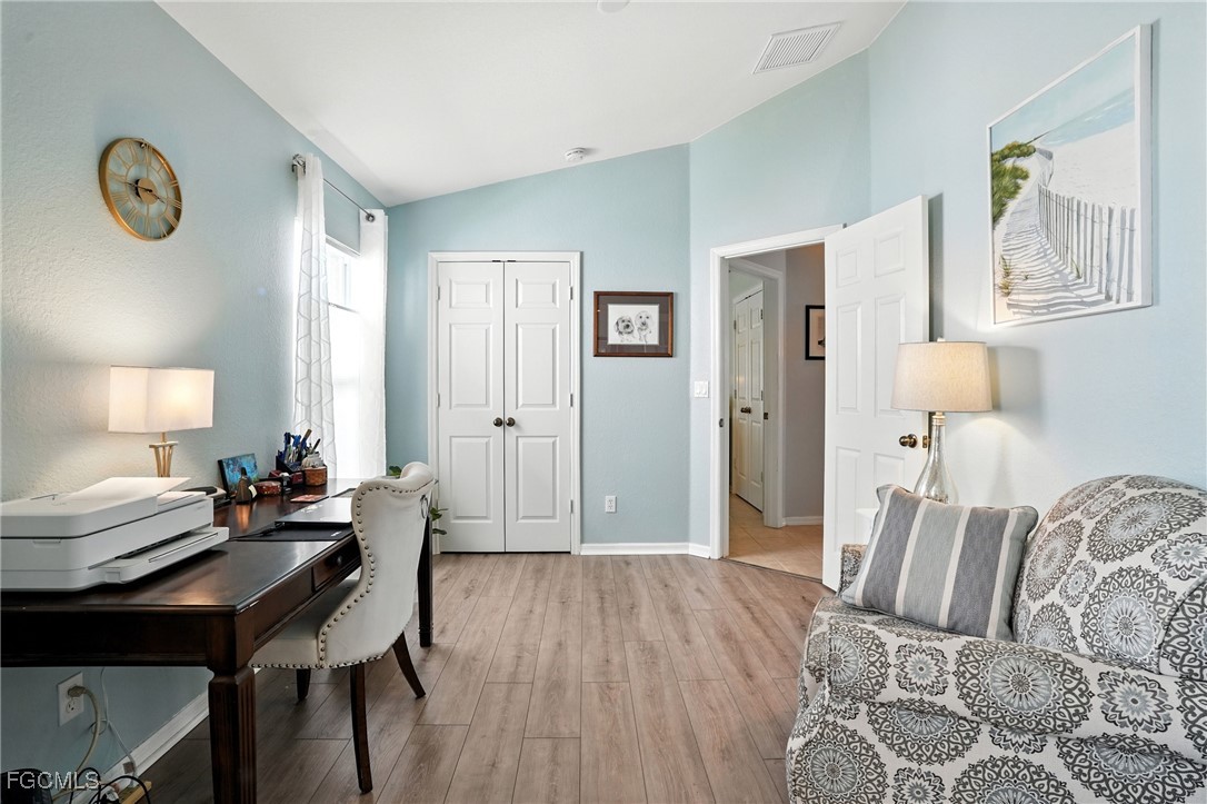 9740 Gladiolus Bulb Loop Fort Myers, FL 33908 - Photo 13 of 26 a bedroom with furniture and a window