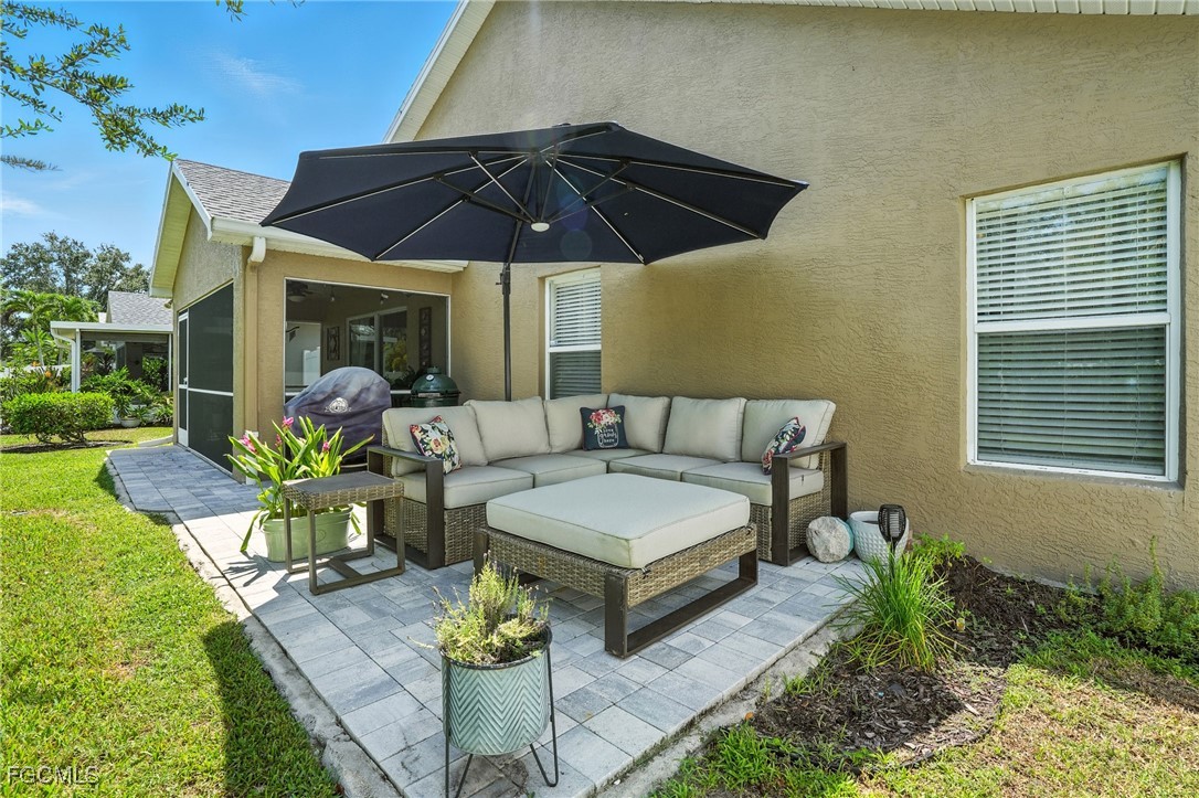9740 Gladiolus Bulb Loop Fort Myers, FL 33908 - Photo 22 of 26 a view of a house with patio outdoor seating