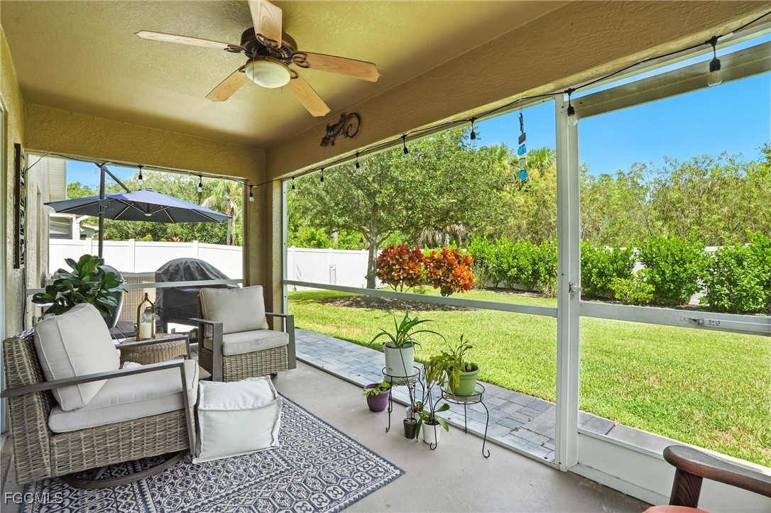 9740 Gladiolus Bulb Loop Fort Myers, FL 33908 - Photo 4 of 26 a outdoor living space with furniture and garden view