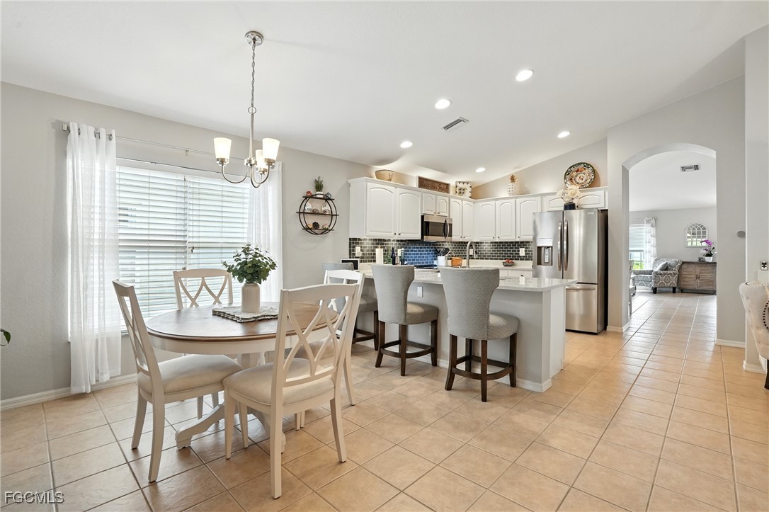 9740 Gladiolus Bulb Loop Fort Myers, FL 33908 - Photo 9 of 26 a view of a dining area with furniture