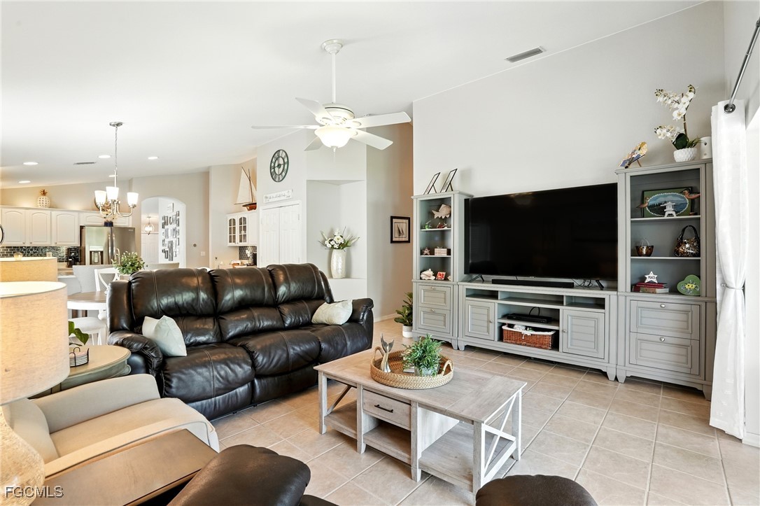 9740 Gladiolus Bulb Loop Fort Myers, FL 33908 - Photo 10 of 26 a living room with furniture and a flat screen tv