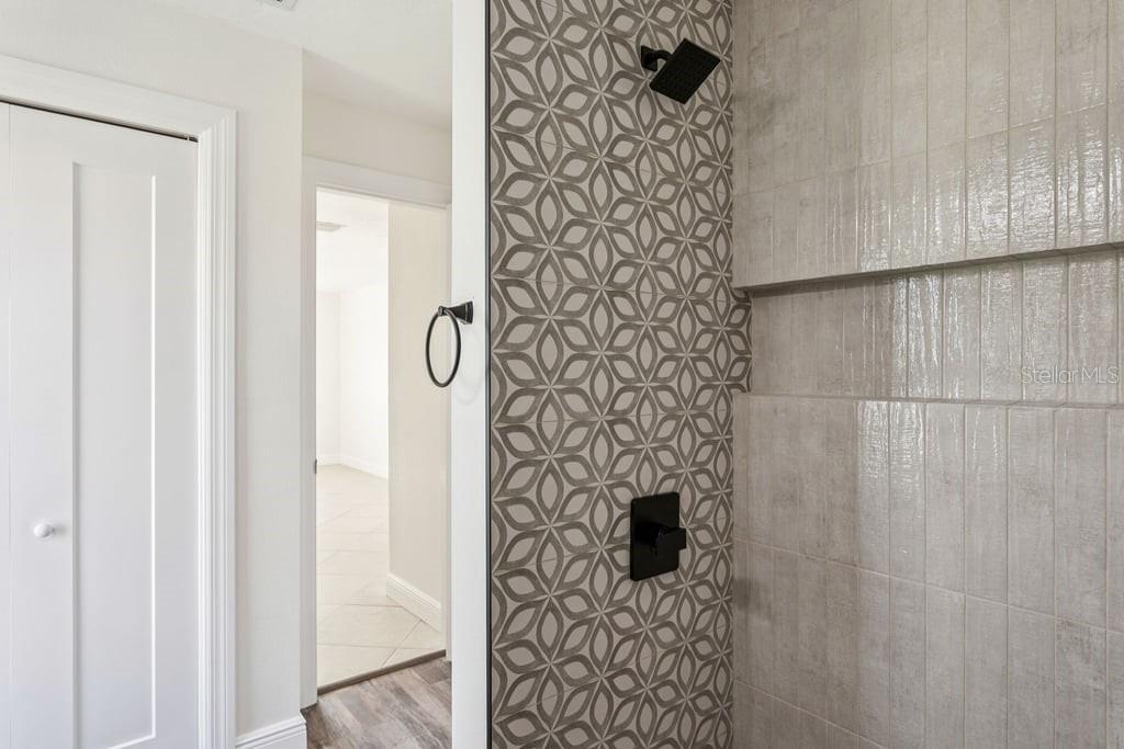 3734 Topsail Trail New Port Richey, FL 34652 - Photo 17 of 65 a bathroom with a shower and a shower curtain