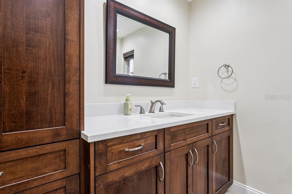 3734 Topsail Trail New Port Richey, FL 34652 - Photo 24 of 65 a bathroom with a sink vanity and mirror