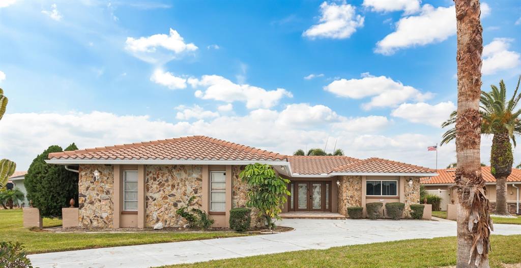 3734 Topsail Trail New Port Richey, FL 34652 - Photo 3 of 65 a front view of a house with garden